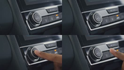 特写，按按钮打开汽车里的空调。高清在线视频素材下载