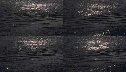夜晚的黑河在月光下微微泛起涟漪，闪闪发光。放松、宁静、和平。抽象高清在线视频素材下载