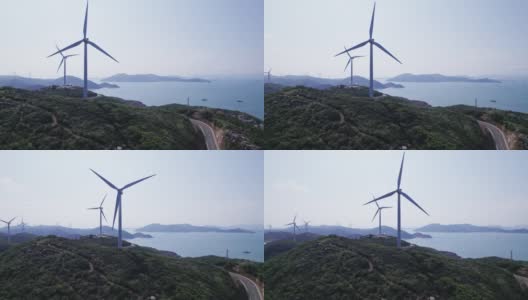 在海边的山顶上安装了风力涡轮机高清在线视频素材下载