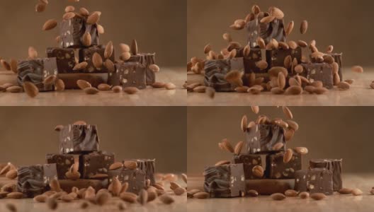 杏仁巧克力软糖与原料下降在慢动作。使用幻影Flex 4K相机拍摄。高清在线视频素材下载