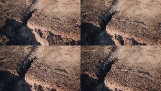 缓慢上升的火山悬崖边缘显示出遥远的火山渣锥高清在线视频素材下载