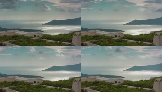 阳光明媚的一天，圣托里尼岛fira镇的屋顶全景，4k时间流逝希腊高清在线视频素材下载
