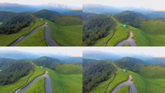 鸟瞰图的墨西哥向日葵与风景公路通过森林，Mae Hong Son省，泰国高清在线视频素材下载