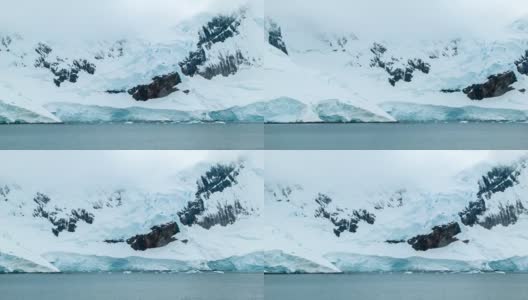 在冰冻的南极山脉景观中淘金高清在线视频素材下载