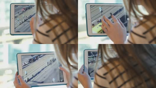 女人用触控板拍摄城市交通的照片高清在线视频素材下载