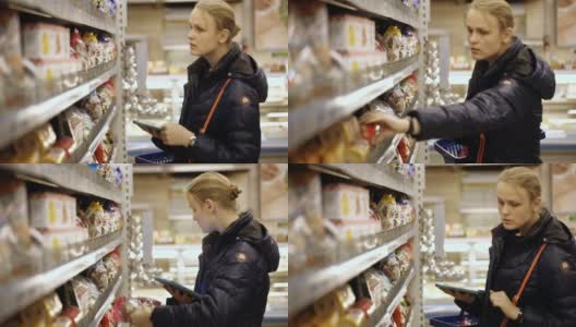 女人在超市买食物，检查它的清单高清在线视频素材下载