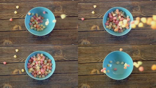 彩色的糖果在慢镜头中落入碗中高清在线视频素材下载