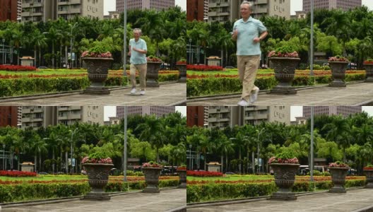微笑活跃的老人在城市慢跑高清在线视频素材下载