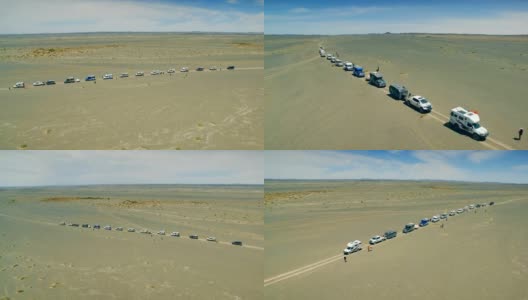 汽车在戈壁沙漠行驶的鸟瞰图，新疆，中国。高清在线视频素材下载