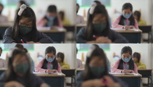 多民族学生戴着面具上课高清在线视频素材下载