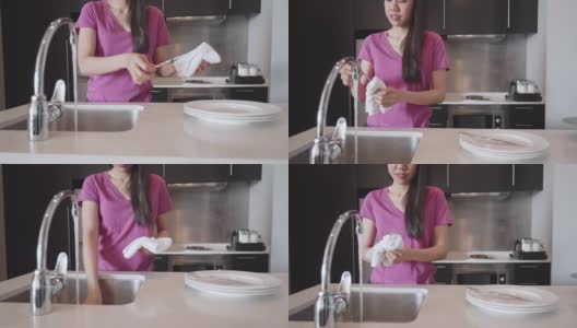 东南亚妇女在她的公寓洗盘子和水果高清在线视频素材下载