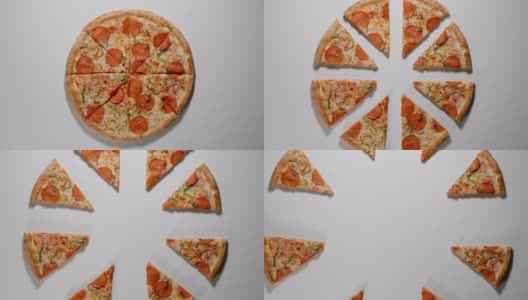 在一张白色的桌子上，人们从不同的方向吃下了几片大披萨高清在线视频素材下载