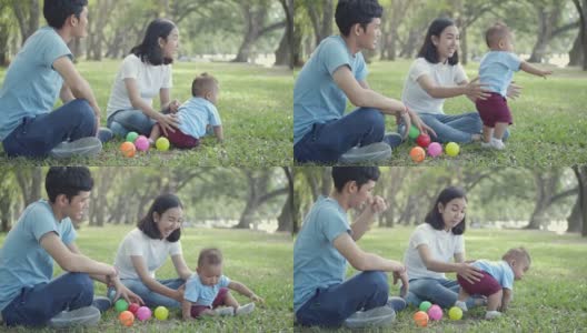 SLO MO亚洲家庭在公园里玩彩色球高清在线视频素材下载