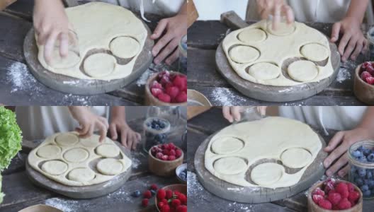 用妇女和儿童的手自制饺子的过程。Pierogi或varenyki高清在线视频素材下载