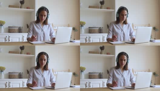 一名年轻女子在网上学习笔记高清在线视频素材下载