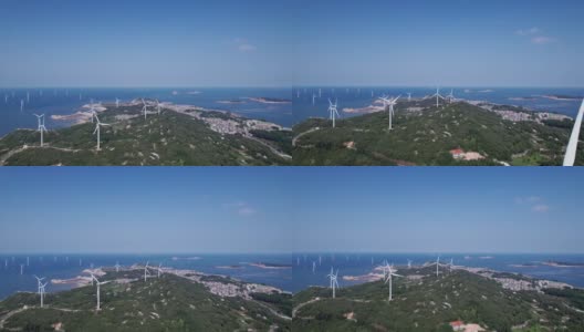 在海边的山顶上风力涡轮机的鸟瞰图高清在线视频素材下载